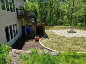 Backyard Limestone Patio Makeover Large Multi Level Retaining Wall by Norwalk Seasonal - Des Moines, Iowa