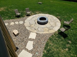 Circular Stone and Brick Fire Pit Large Multi Level Retaining Wall by Norwalk Seasonal - Des Moines, Iowa