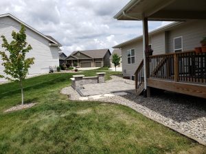 Stone and Rock Patio off Deck Large Multi Level Retaining Wall by Norwalk Seasonal - Des Moines, Iowa