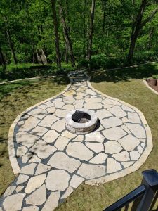 Custom Limestone Patio with Fire Pit Large Multi Level Retaining Wall by Norwalk Seasonal - Des Moines, Iowa