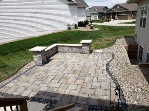 Backyard Custom Stone Patio Large Multi Level Retaining Wall by Norwalk Seasonal - Des Moines, Iowa