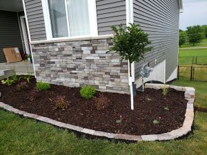 Stone and Mulch Landscaping Large Multi Level Retaining Wall by Norwalk Seasonal - Des Moines, Iowa