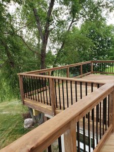 Metal and Wooden Railing Large Multi Level Retaining Wall by Norwalk Seasonal - Des Moines, Iowa