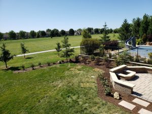 Backyard Patio Makeover Large Multi Level Retaining Wall by Norwalk Seasonal - Des Moines, Iowa