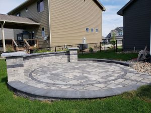 Circular Stone Patio and Wall Large Multi Level Retaining Wall by Norwalk Seasonal - Des Moines, Iowa