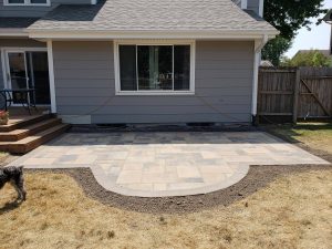 Backyard stonework patio landing by Norwalk Seasonal - Des Moines, Iowa