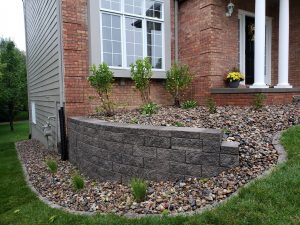 Front yard Belgard retaining wall and rock garden by Norwalk Seasonal - Des Moines, Iowa