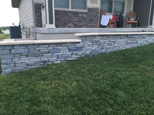 Brick and Stone retaining wall by Norwalk Seasonal - Des Moines, Iowa
