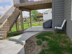 Backyard Concrete Patio Large Multi Level Retaining Wall by Norwalk Seasonal - Des Moines, Iowa