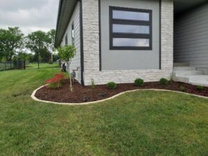 Landscaping, Limestone edgers, Mulch, and Plantings by Norwalk Seasonal - Des Moines, Iowa