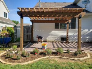 Pergola and Brick Patio with Plant Installation by Norwalk Seasonal - Des Moines, Iowa