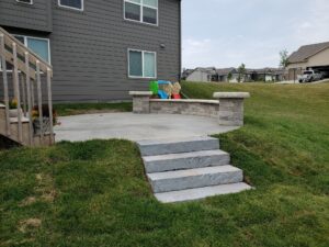 Backyard stairs with patio by Norwalk Seasonal - Des Moines, Iowa