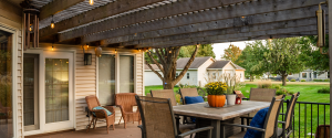 Deck, pergola and patio furniture with warm colors - browns, oranges, and creams.